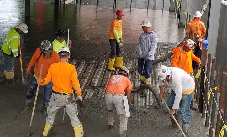 Concrete is poured to make floors